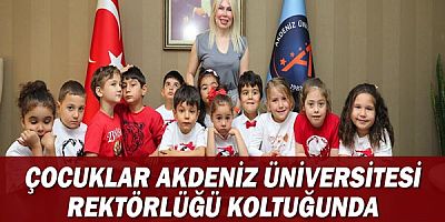 Çocuklar Akdeniz Üniversitesi Rektörlüğü koltuğunda